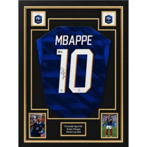 Kylian Mbappé – Gesigneerd Frankrijk WK 2026 Shirt | Professioneel Ingelijst & Gecertificeerd Een exclusief verzamelstuk van één van de grootste sterren van het moderne voetbal: Kylian Mbappé. Dit Frankrijk WK 2026-shirt is persoonlijk gesigneerd door Kylian Mbappé en professioneel verwerkt in een luxe memorabilia-display. Een indrukwekkend collectors item dat de snelheid, klasse en wereldwijde uitstraling van één van de meest iconische voetballers van deze generatie weerspiegelt. Een wereldster op het grootste podium Kylian Mbappé heeft zich in korte tijd ontwikkeld tot één van de absolute gezichten van het internationale voetbal. Met zijn explosieve snelheid, technische kwaliteiten en doelpunteninstinct behoort hij al jarenlang tot de wereldtop. Dit gesigneerde Frankrijk WK 2026-shirt staat symbool voor zijn optreden op het grootste voetbalpodium ter wereld en vormt een bijzonder verzamelobject voor iedere liefhebber van voetbalmemorabilia. Gesigneerd & gecertificeerd Het shirt is persoonlijk gesigneerd door Kylian Mbappé en wordt geleverd met een certificaat van echtheid. Daarnaast is het professioneel ingelijst met hoogwaardige materialen om het shirt optimaal te presenteren én te beschermen. Hierdoor is het direct klaar om een prominente plaats te krijgen in een collectie, kantoor, mancave of andere bijzondere ruimte. Productkenmerken: Frankrijk WK 2026 voetbalshirt Persoonlijk gesigneerd door Kylian Mbappé Inclusief certificaat van echtheid Professioneel en luxe ingelijst Premium voetbalmemorabilia Exclusief display- en verzamelobject Direct klaar om tentoongesteld te worden Een premium collectors item Gesigneerde memorabilia van Kylian Mbappé behoren tot de meest gewilde verzamelobjecten binnen de moderne voetbalwereld. Dit professioneel ingelijste WK 2026-shirt combineert authenticiteit, exclusiviteit en een hoogwaardige presentatie in één indrukwekkend display. Een premium verzamelstuk voor liefhebbers van Kylian Mbappé, het Franse nationale elftal en exclusieve voetbalmemorabilia. Een handtekening van een wereldster. Een premium display. Een blikvanger voor iedere collectie.